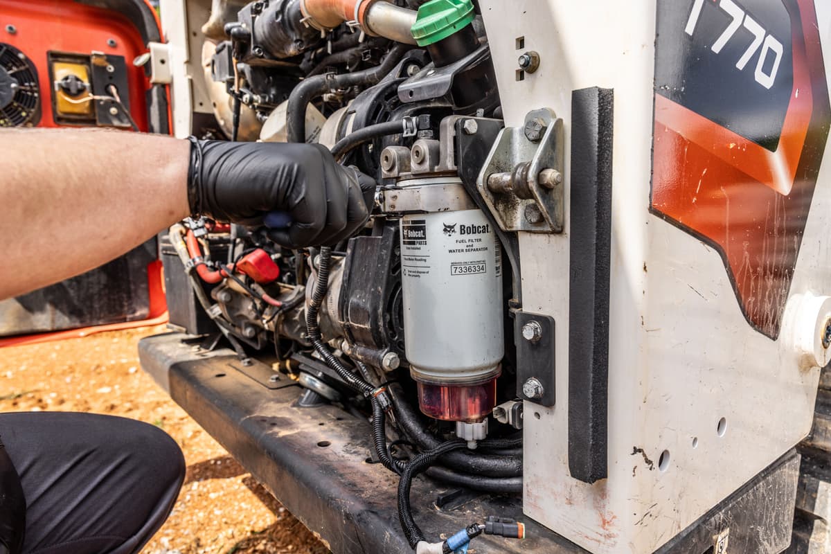 Technician Servicing Bobcat Equipment